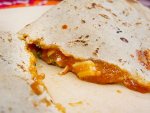 A close-up of empanada con mole amarillo at Fonda Florecita in Oaxaca, Mexico.