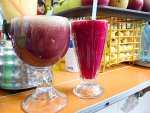 Two glasses of aguas frescas or jugos from Jugos Teresita in Oaxaca, Mexico.
