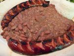 A plate of red beans and reice with spicy andouille sausage.