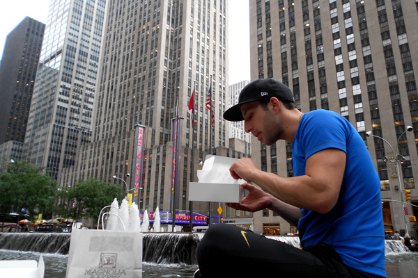 Alec of Still Served Warm eating Magnolia Cupcakes in midtown Manhattan