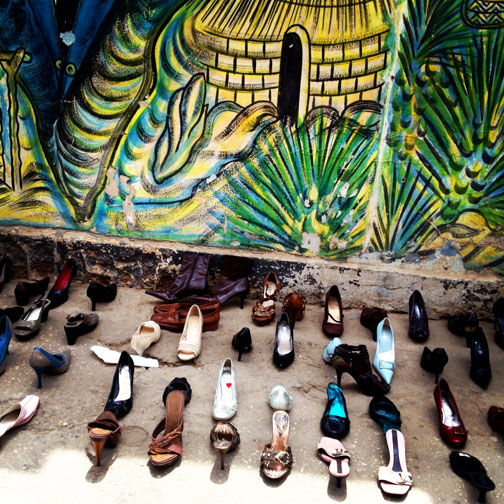 A painted mural and shoes in Dakar, Senegal.