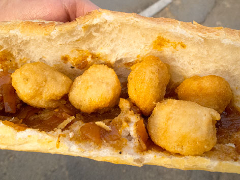 Accara on bread, street food in Dakar