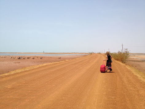 Laura in Sine Saloum with red bag, Senegal