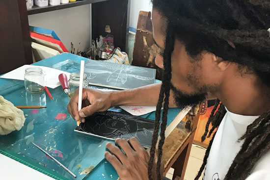 An artist works in a studio in Havana, Cuba, open for art classes to tourists.