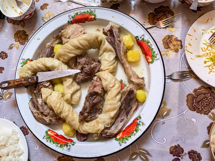 A plate of Kazakh meat and fried dough in western Mongolia.
