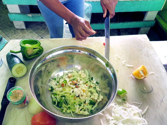 Vendor making conch salad in the Bahamas