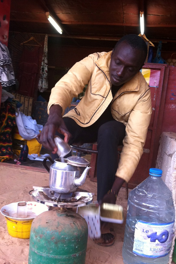 Senegalese man makes green tea in Popenguine, Senegal