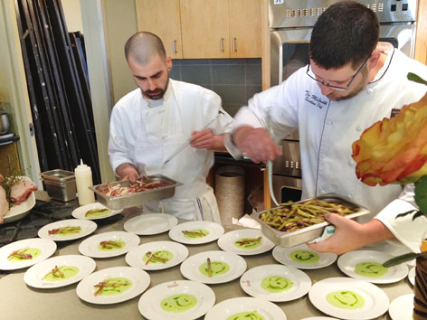 Chef Tim McGrath plating dishes at a NYC culinary event