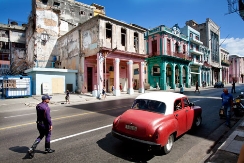 A policeman approaches a car in Central Havana, Cuba. 