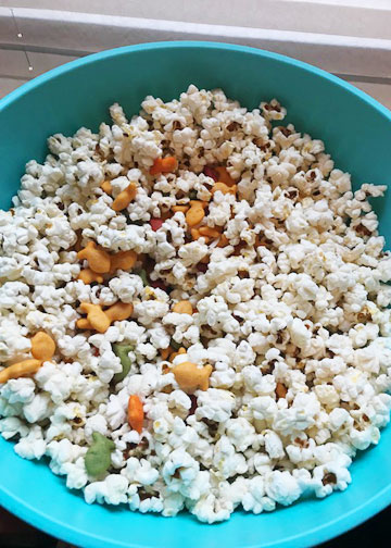 Popcorn mixed with Goldfish crackers for a movie night. 