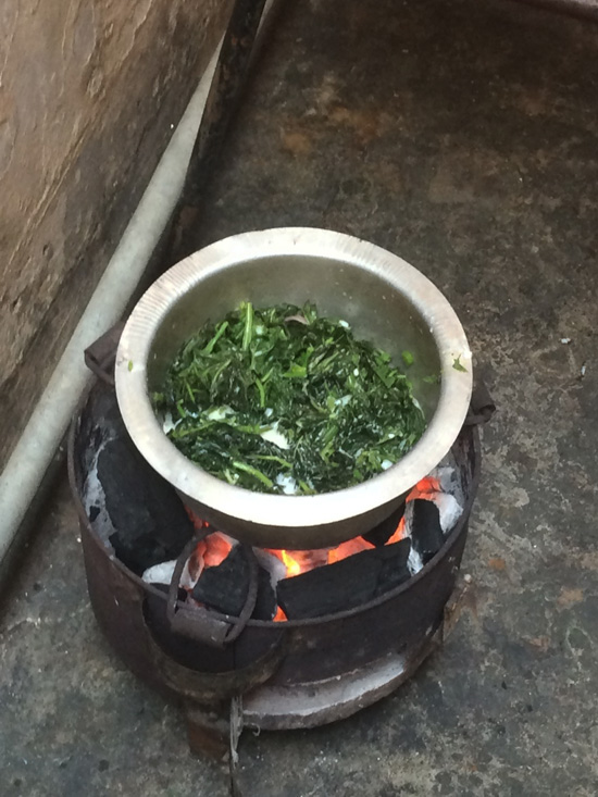 Cooking spinach in coconut milk in Zanzibar