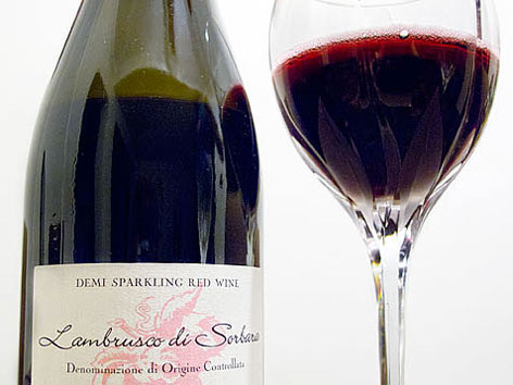 A bottle and glass of Lambrusco wine, from Emilia-Romagna, Italy