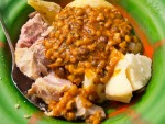 A bowl of binch (beans) over boiled potatoes from Bo, Sierra Leone.