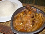 A plate of yassa poulet with rice from Point d’Interrogation in Dakar, Senegal.
