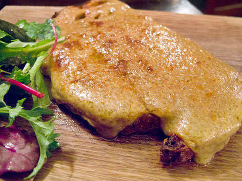 Welsh rarebit and salad from a pub in London, England