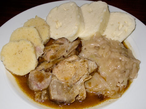Vepro-knedlo-zelo in Prague, a traditional combo of roast pork, bread dumplings and stewed cabbage.
