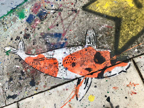 Sidewalk art in the Wynwood Arts District of Miami, Florida.