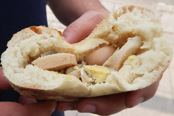 Ka'ak, a sesame bread with hard-boiled egg, is a popular street food in Amman, Jordan.