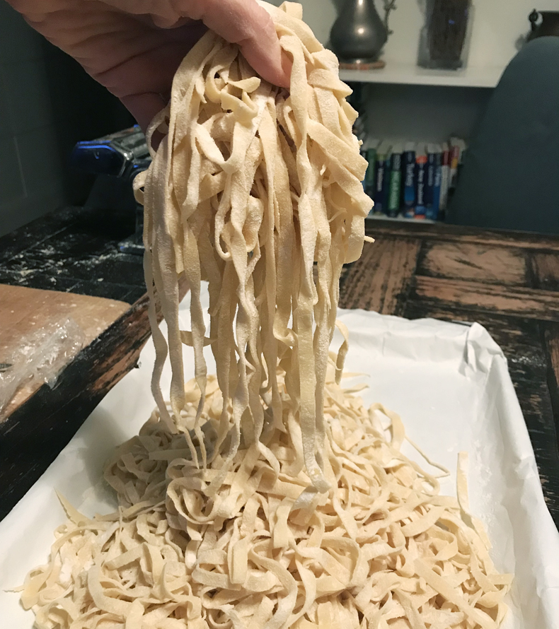 A handful of fresh fettuccine pasta in a home kitchen