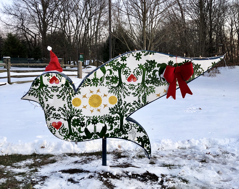 A snow-covered hand-painted dove on the Sullivan Catskills Dove Trail