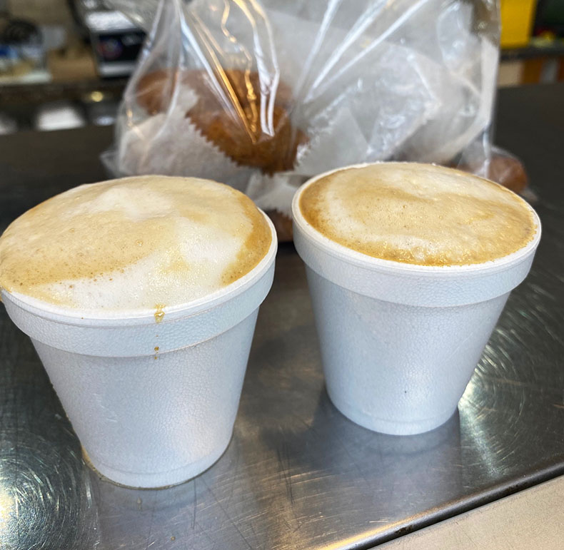 Two cortadito coffees from a Cuban restaurant inside a gas station store in Lake Worth Beach, Florida.