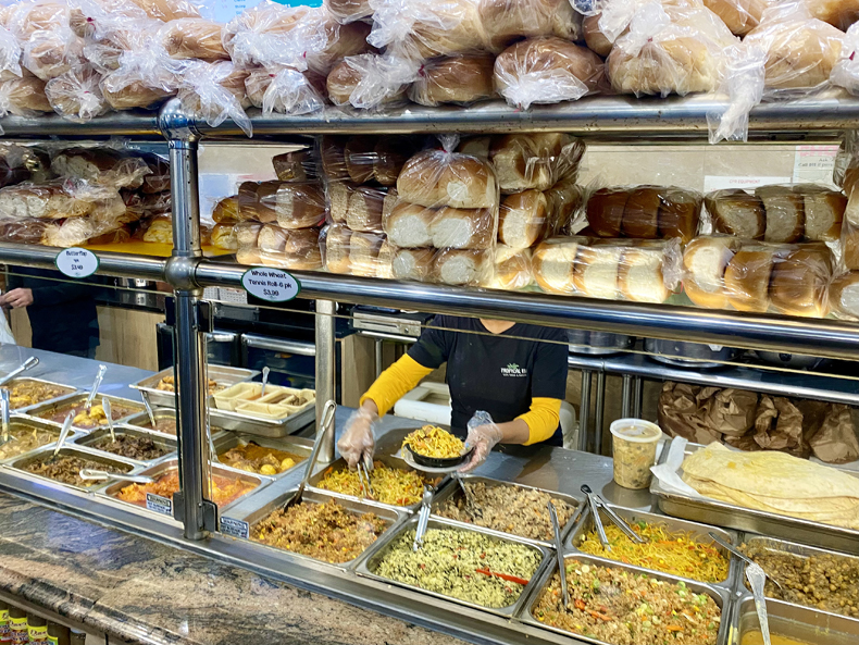 The steamtable and Guyanese breads at Tropical Isle in South Richmond Hill, Queens