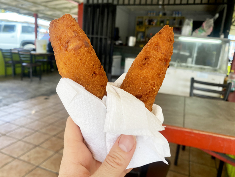 Alcapurrias, fried elongated fritters of plantain and taro, from a roadside kiosk in Pinones, Puerto Rico