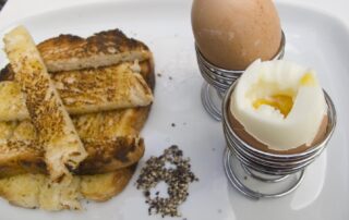 Boiled eggs and soldiers, or sliced toast, from a London cafe, England