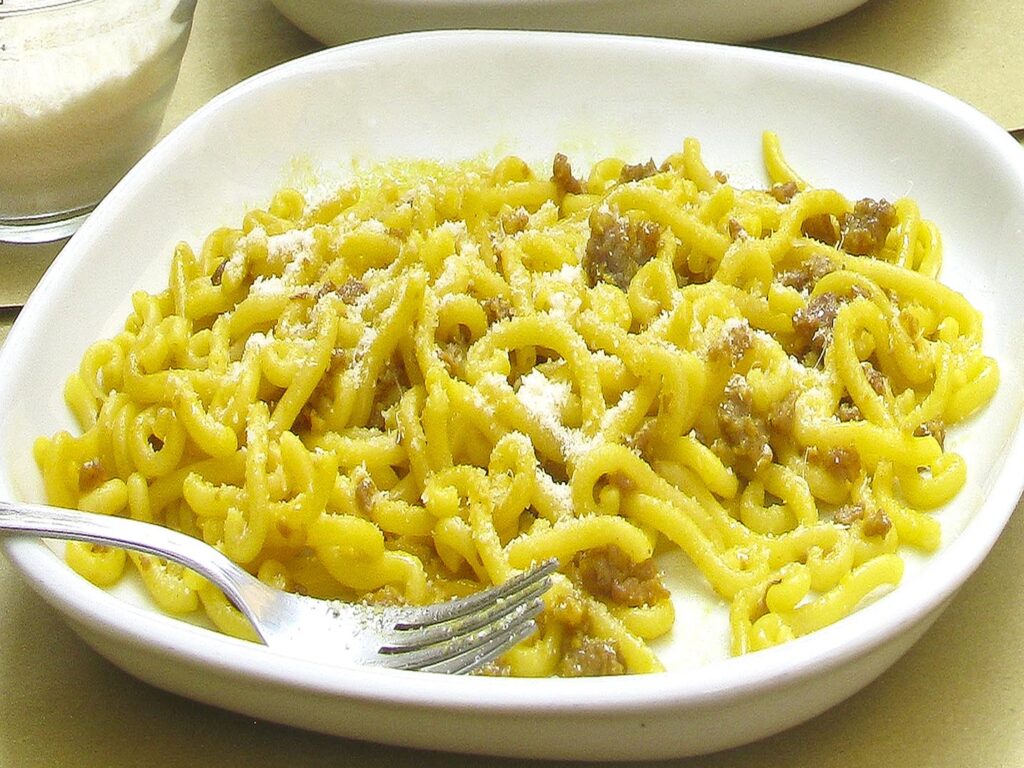 Bowl of gramigna con salsiccia pasta in Bologna, Italy