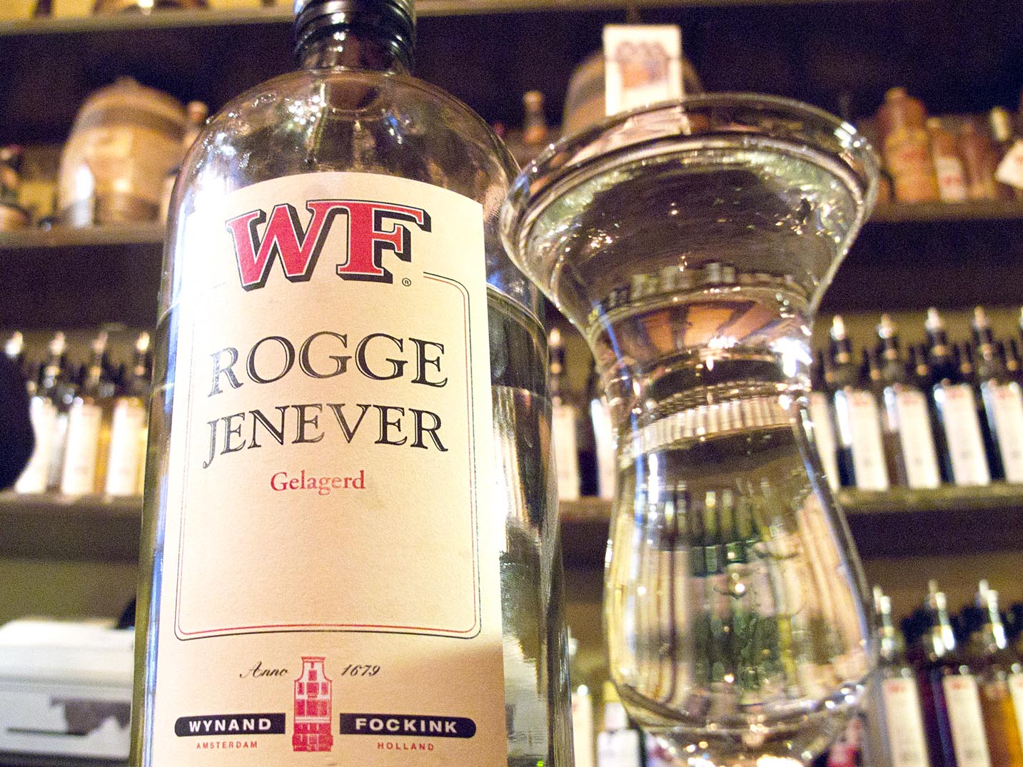 A bottle and glass of local jenever from Proeflokaal Wynand Fockink in Amsterdam.