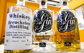 Bottles of whiskey and gin distilled in Brooklyn, NY, at Breukelen Distilling