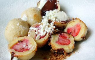 Plate of ovocné knedlíky, or sweet fruit dumplings, from Cafe Savoy in Prague, Czech Republic