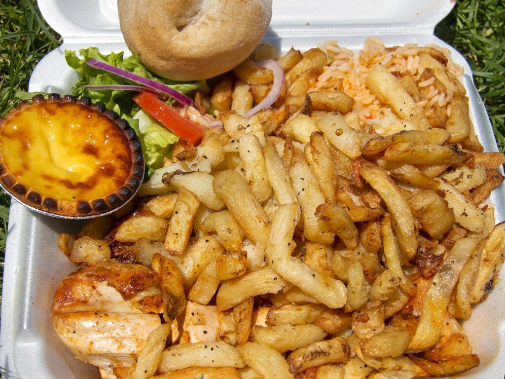 Portuguese chicken, fries, salad, and egg tart from Romados in Montreal, Quebec