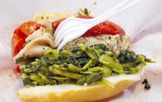 A roast pork sandwich with broccoli rabe from DiNic's in Philadelphia.