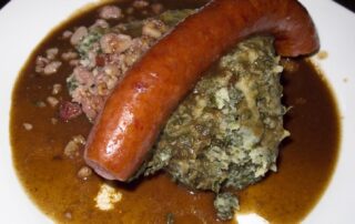 Boerenkool (kale) stamppot, with rookworst, from a restaurant in Amsterdam, the Netherlands.