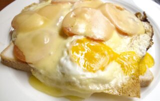 Uitsmijter, a Dutch breakfast with eggs, ham, and cheese, from a cafe in Amsterdam, The Netherlands