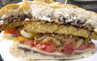 A vegan Havana Cuban sandwich made of tempeh from Laughing Seed in Asheville, North Carolina.
