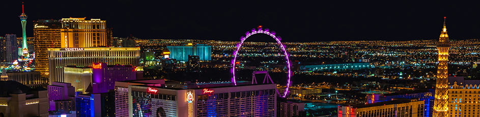 A panoramic of Las Vegas hotels and casinos at night.
