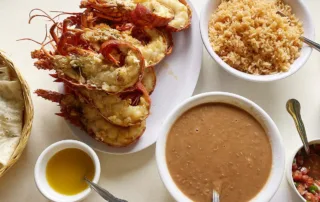 Puerto Nuevo lobster with rice, beans, and tortillas, from Puerto Nuevo, Baja California.