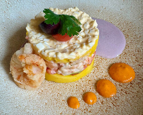 A colorful plate of causa, a local Peruvian potato casserole, from El Mercado restaurant in Lima.