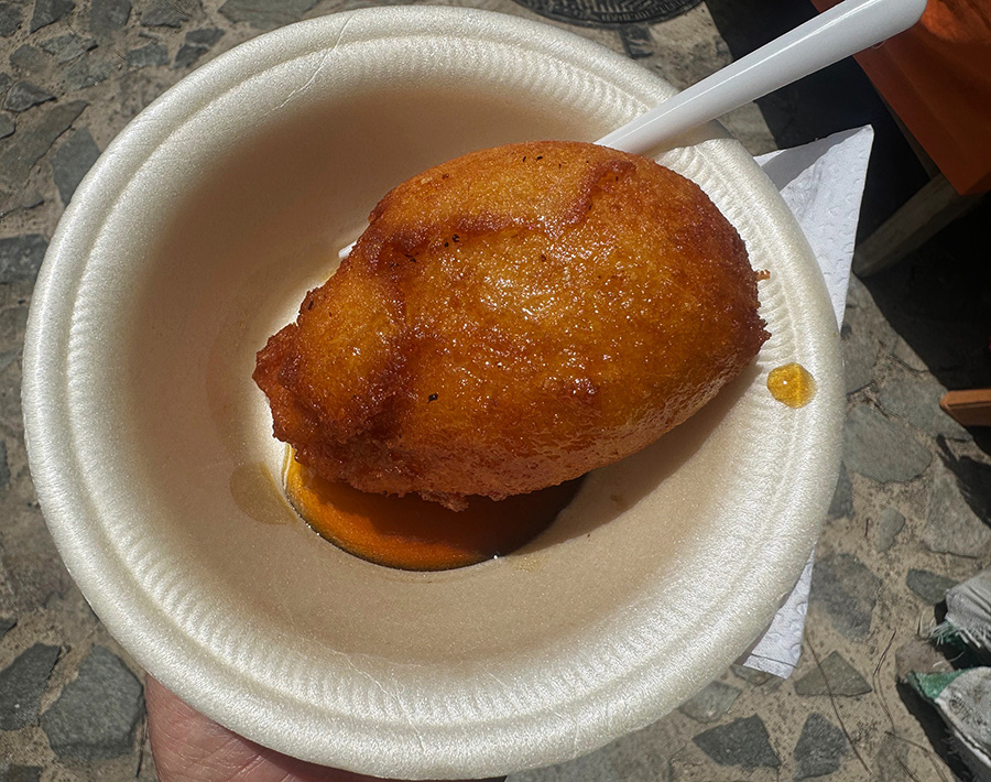 Nuegado de yuca, deep-fried cassava fritters in honey, from a weekend food festival in Juayua, El Salvador.