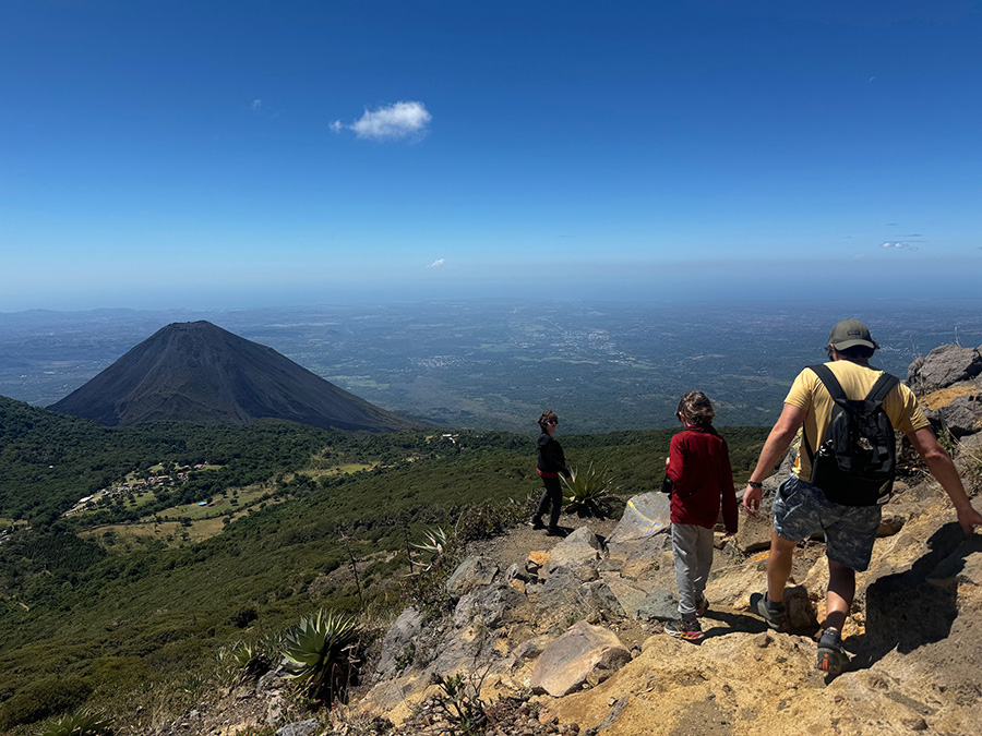 A family of hikers descending from Santa Ana volcano in El Salvador
