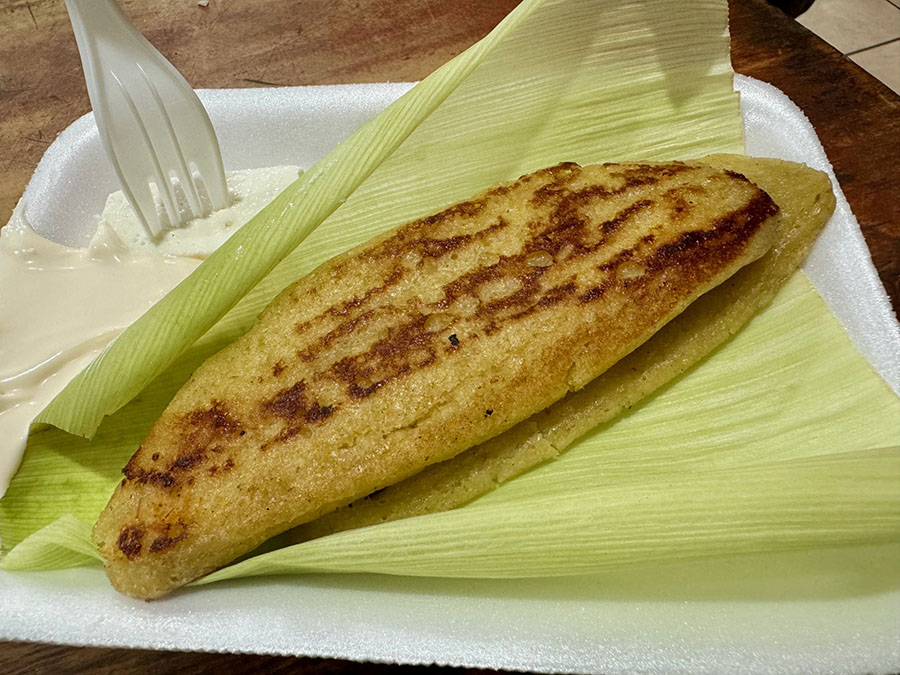 Buttery corn-based riguas, a popular Salvadoran food, wrapped in a corn husk, in El Salvador.